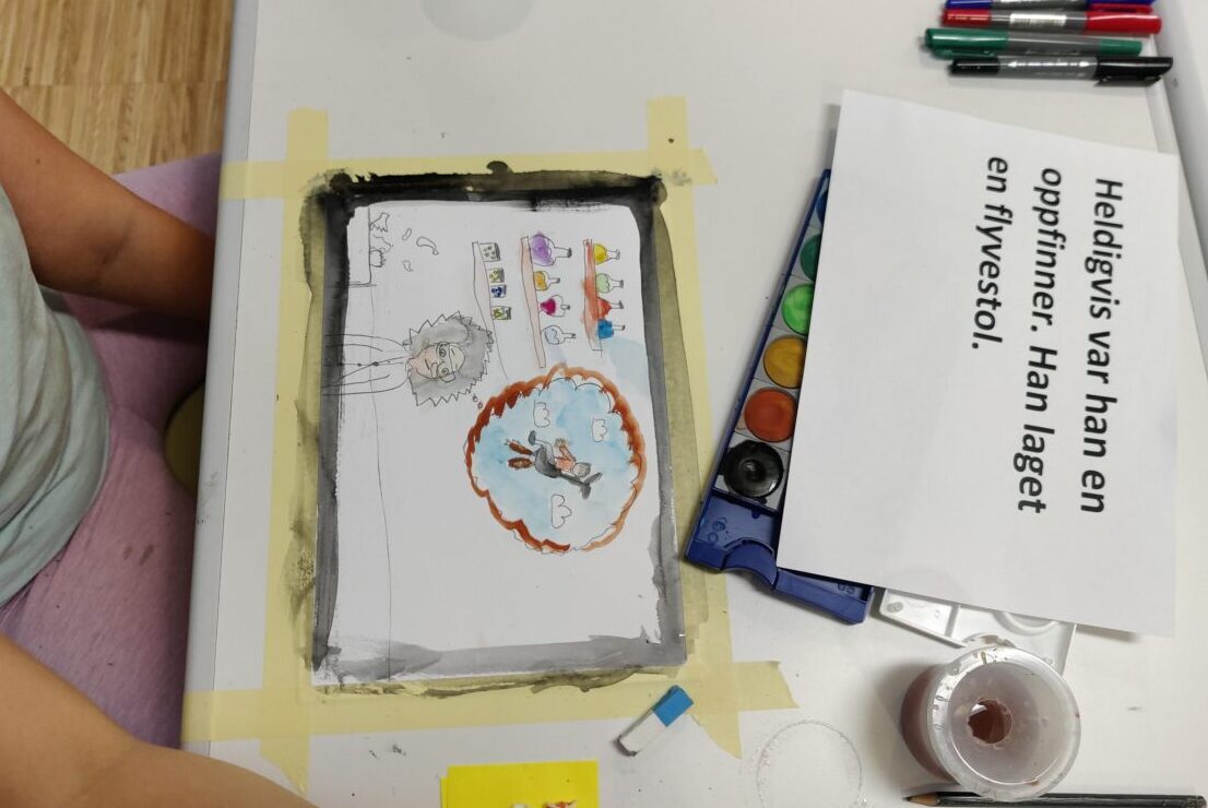 Barn som maler i utgangspunkt i en linje tekst